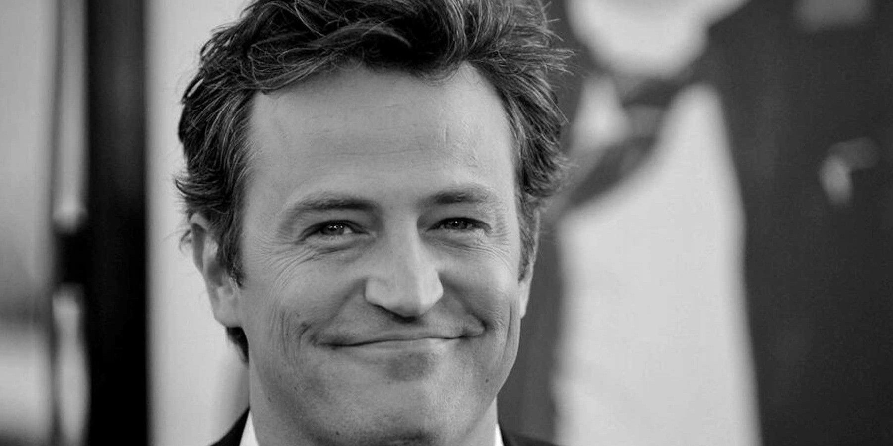 A black and white photo of Matthew Perry in Matthew Perry: A Hollywood Tragedy