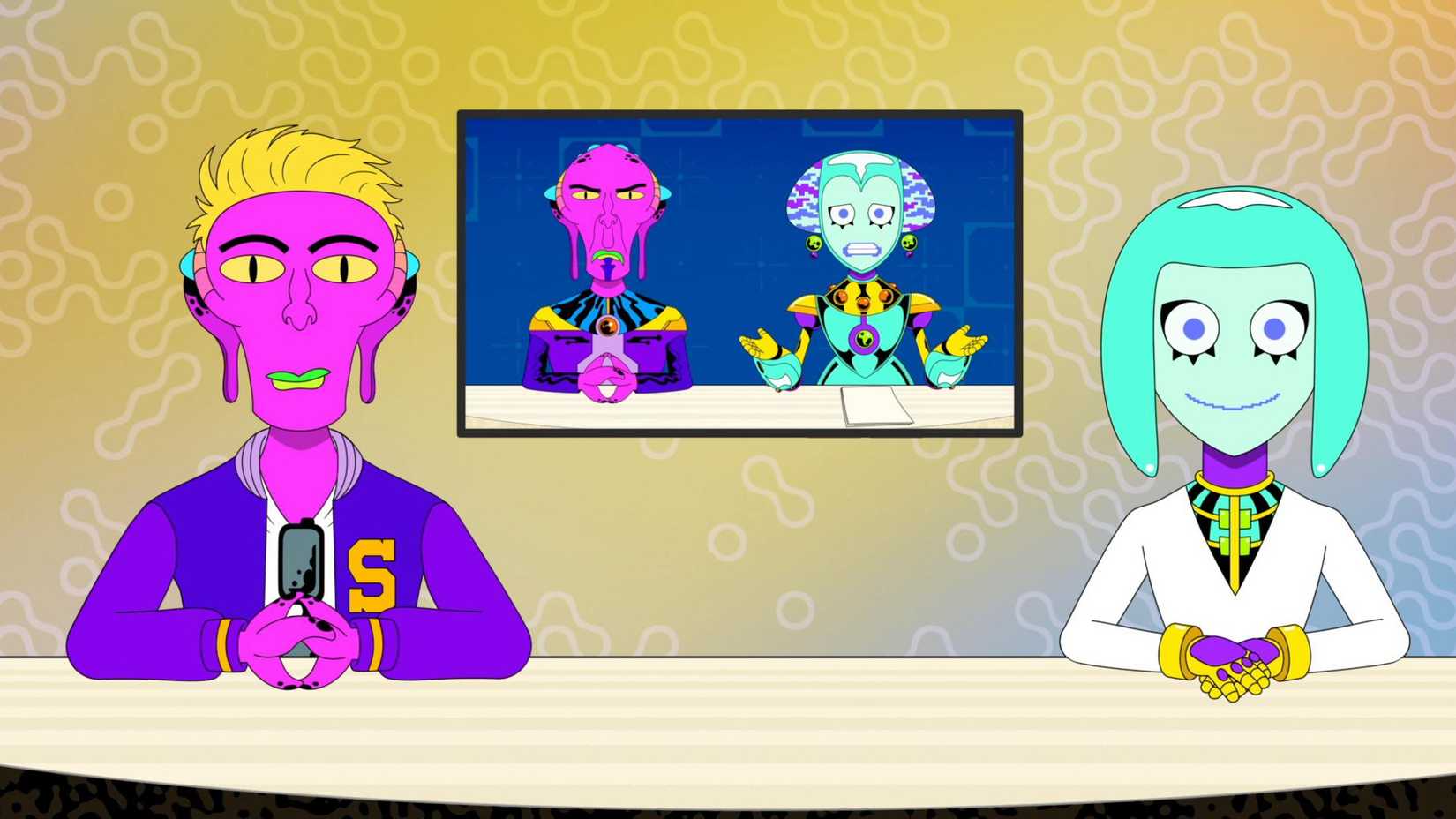 Apresentadores do Alien News Desk sentados no estúdio