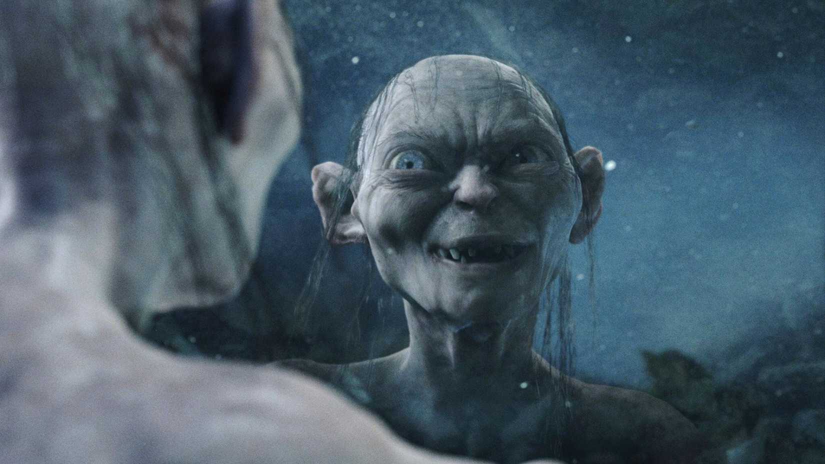 Gollum sorri para Sméagol em seu reflexo em O Senhor dos Anéis: O Retorno do Rei